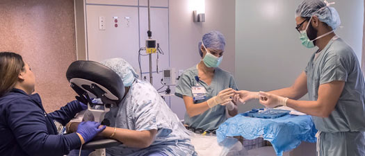 Anesthesiologist giving an epidural