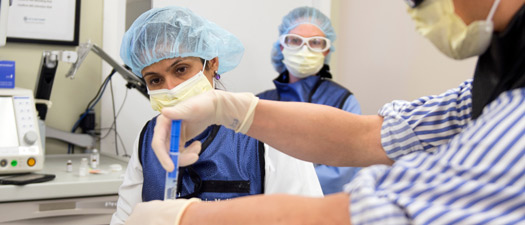 Pain medicine doctors in procedure room